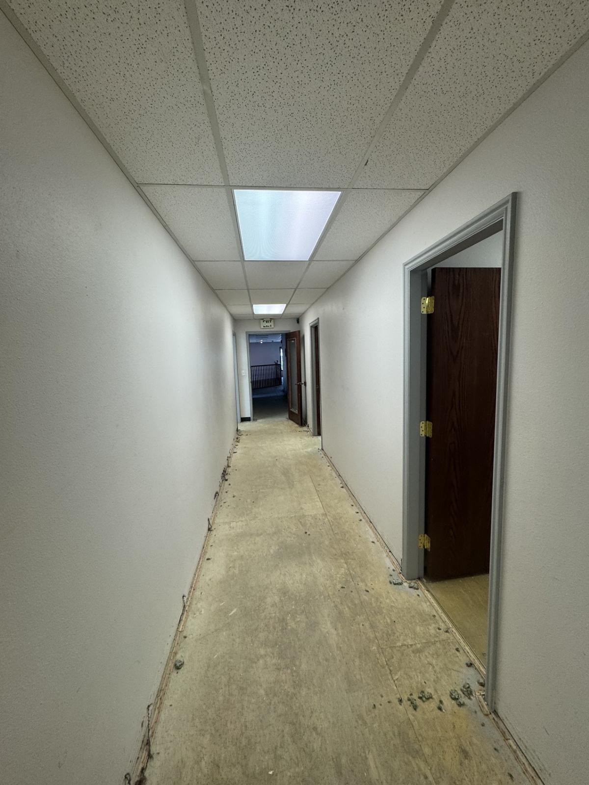 Interior corridor lined with wood office doors
