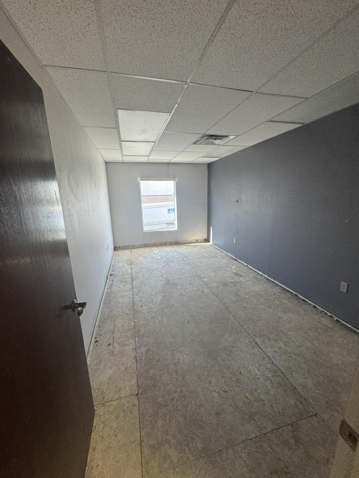 Private office with a window looking out toward the truck yard