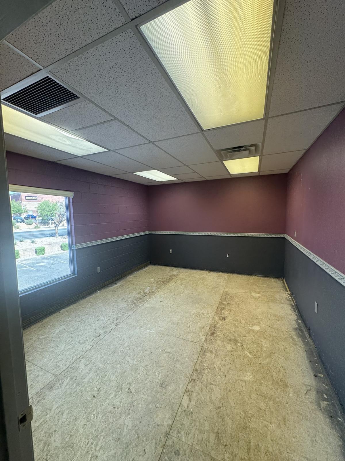 Private office with a large window facing the parking lot